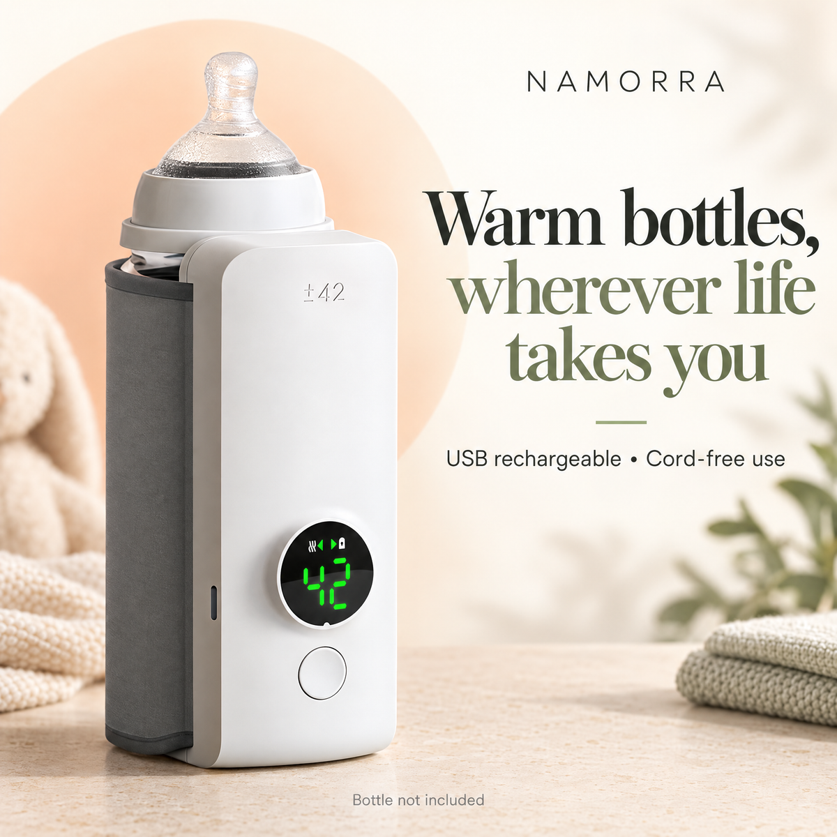 White bottle warmer with grey sleeve and round front display, shown beside a clear bottle on a pale background.