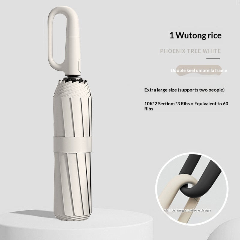 Closed folding umbrella with ring handle and close-up handle detail