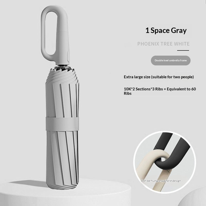 Closed folding umbrella with ring handle and close-up handle detail