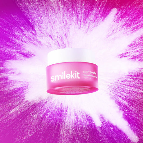 Pink Smilekit powder jar centred on a bright pink powder burst