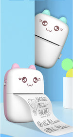 Pink printer printing illustrated paper, with a blue version shown above
