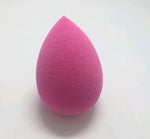 Rose pink teardrop Makeup Sponge Puff on a light surface