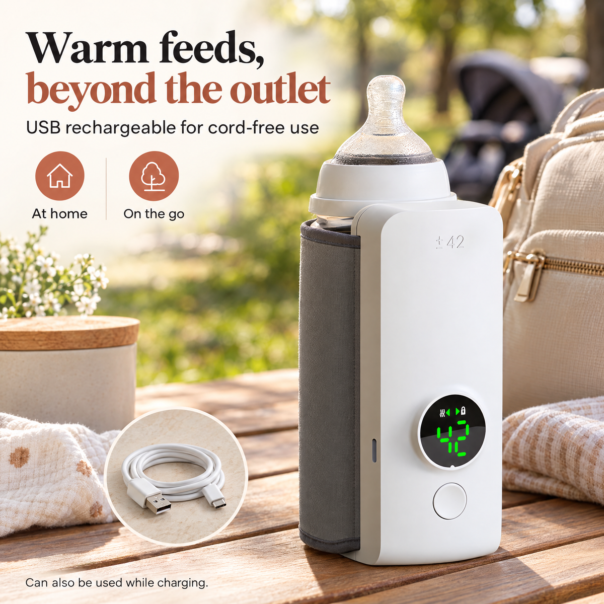 White warmer with grey sleeve and a clear bottle outdoors, with a coiled cable visible on the table.