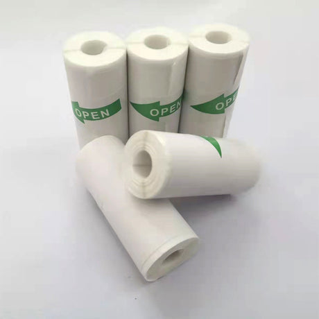 Five white paper rolls, some labelled with green OPEN arrows