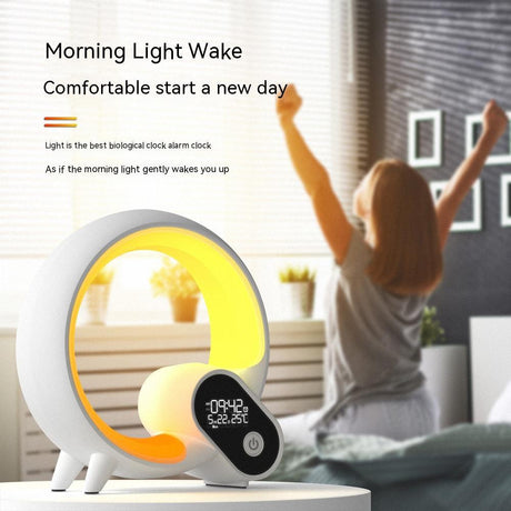 White Q Light clock glowing yellow on bedside table in a bedroom scene