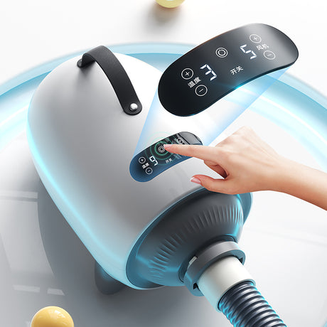 Close-up of white pet hair dryer touch screen being pressed, with hose attached
