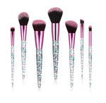 Makeup brush set with teal glitter handles, pink ferrules and black-and-pink bristles