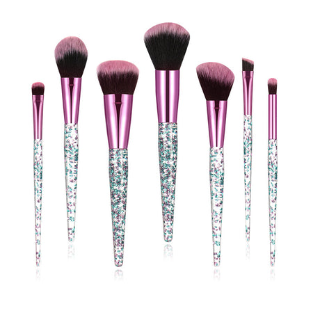 Makeup brush set with teal glitter handles, pink ferrules and black-and-pink bristles