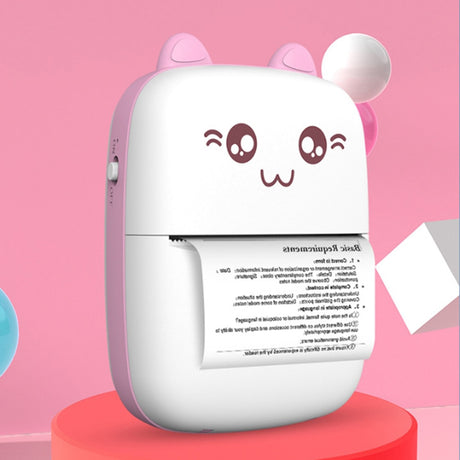 Pink mini printer on a red plinth, printing a text sheet