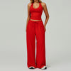Women's bright red halter crop top and matching wide leg trousers, front view.