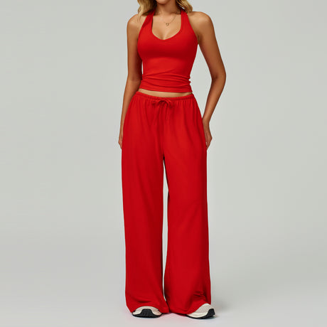 Women's bright red halter crop top and matching wide leg trousers, front view.