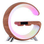 Brown wood-effect G-shaped LED lamp glowing pastel colours, with dark clock display