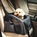 Grey pet travel carrier on a car seat with a small dog inside