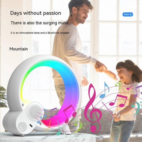 Q Light clock rear view with circular speaker grilles and colourful music graphics