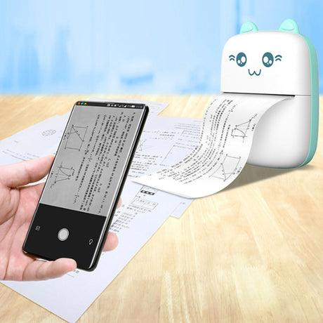 Blue mini printer printing diagrams beside a phone on a wooden table