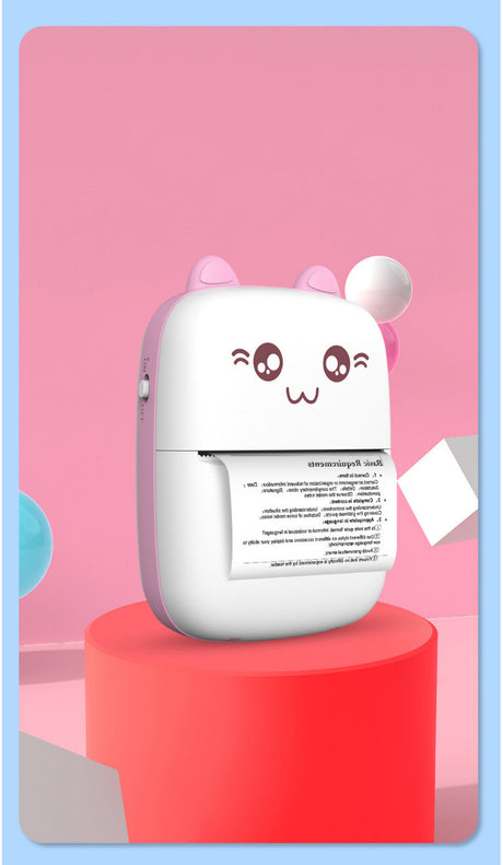 Pink mini printer on a red plinth, printing a text sheet