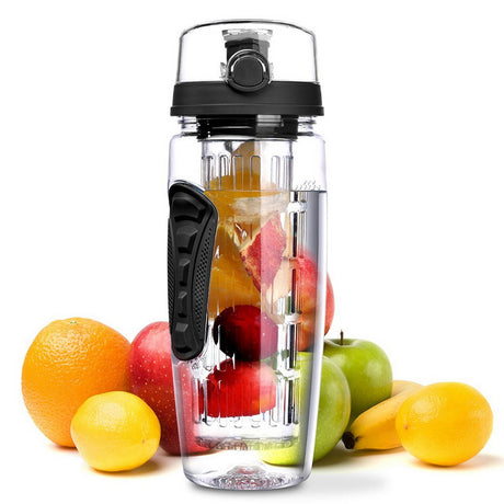 Fruit infuser water bottle with black lid, standing among assorted fruit