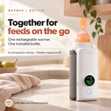White bottle warmer with a grey sleeve wrapped around a bottle with an orange top, shown on a countertop.