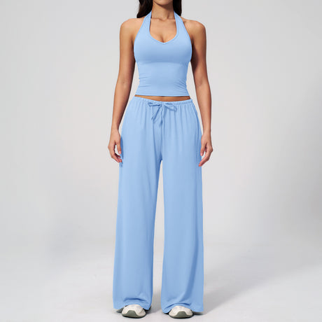 Women's sky blue halter crop top and matching wide leg trousers, front view.