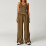 Women's brown halter crop top and matching wide leg trousers, front view.