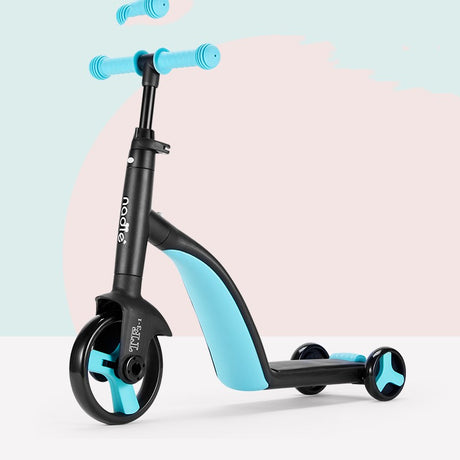 Black and blue three-wheel scooter on a pastel studio background