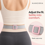 Rear view of the NAMORRA waist belt strap and pink adjuster worn over clothing.