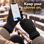 Black heated gloves worn while using a smartphone outdoors