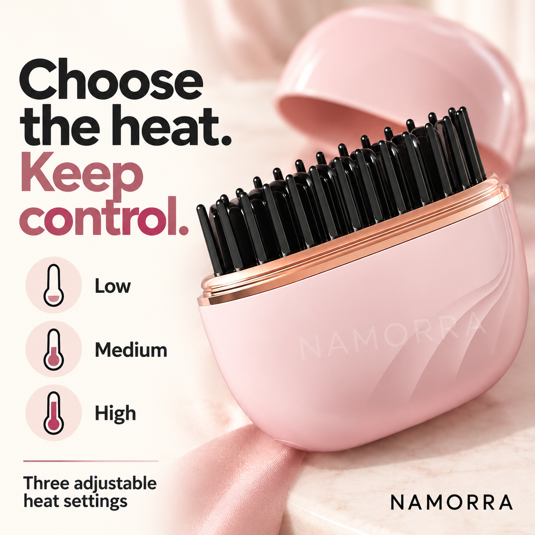 Pink straightening comb showing low medium and high heat settings