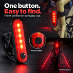 Black front power button on slim rounded red tail light